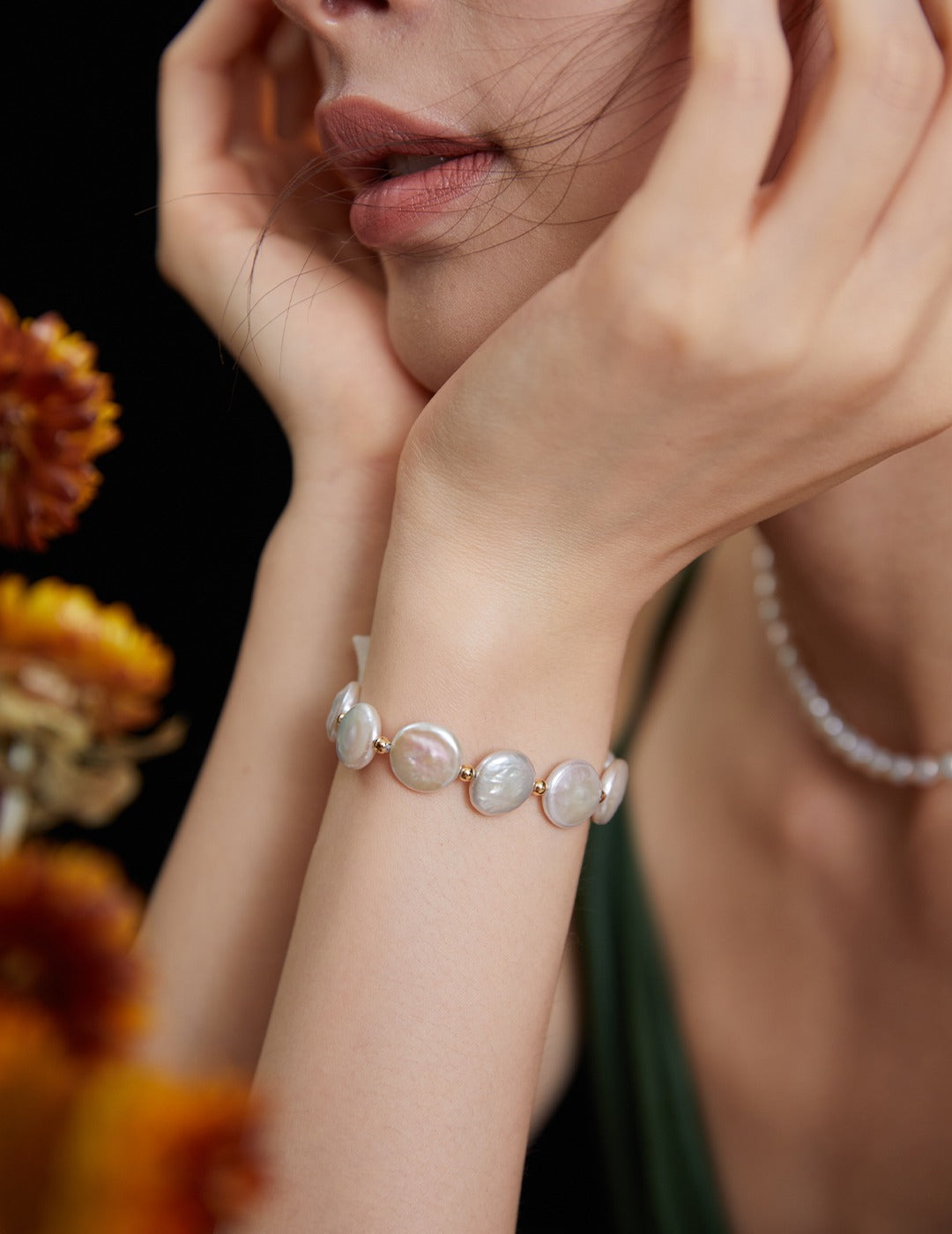 Female with elegant pearls bracelet.