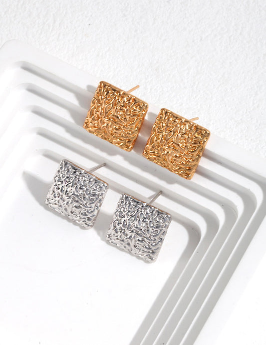 Bold square studs in gold and silver, perfect for a chic look.