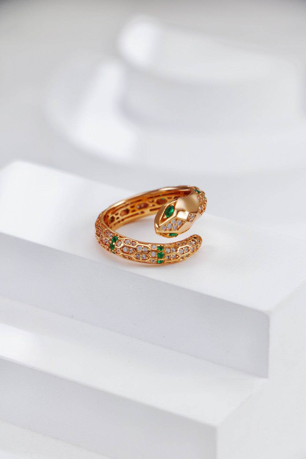 A luxurious snake ring in gold, featuring shimmering cubic zirconia for a striking look.