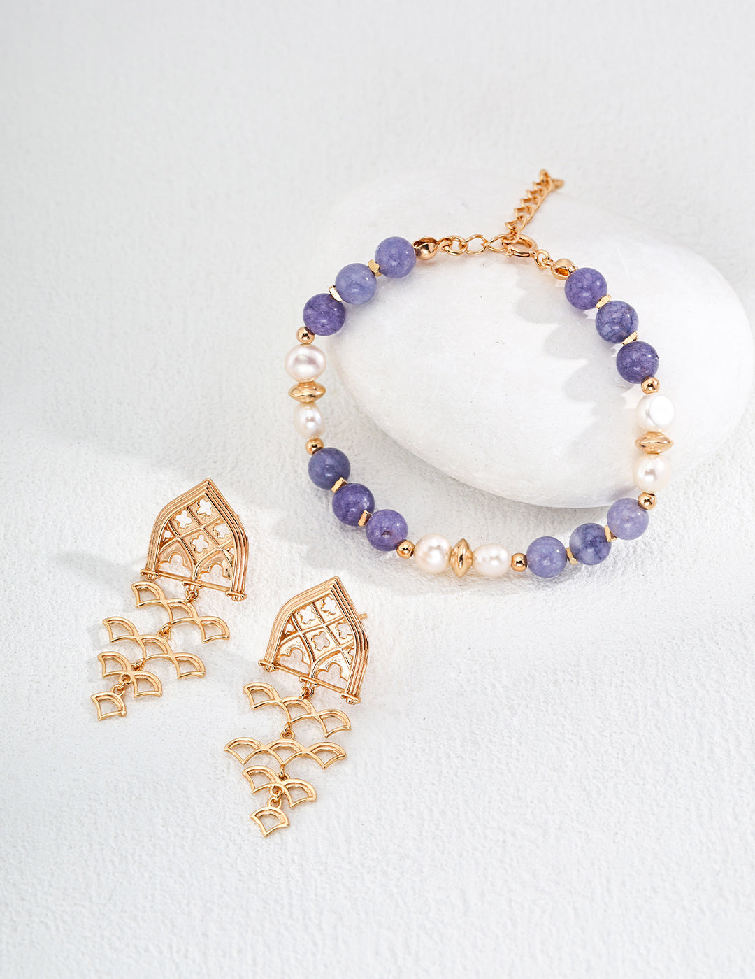 Beautiful blue and gold bead bracelet and earrings set, enhanced by the delicate touch of kunzite stones.