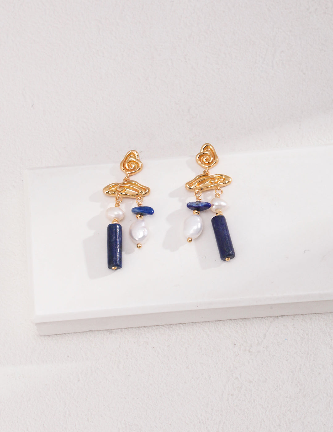 Gold plated dangles with lapis lazuli and freshwater pearls.