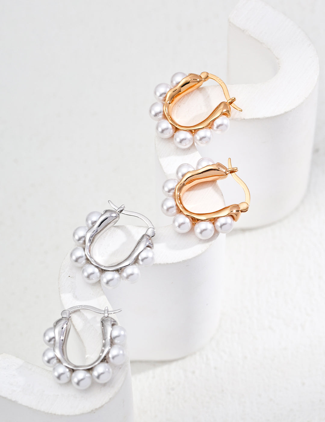 Shell pearls chic hoop earrings, available in silver or gold for a versatile look.