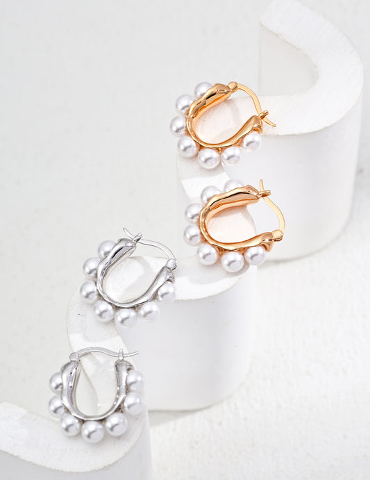 Shell pearls chic hoop earrings, available in silver or gold for a versatile look.