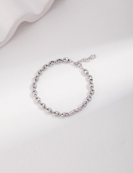 Silver bracelet with delicate chain of interlocking links.