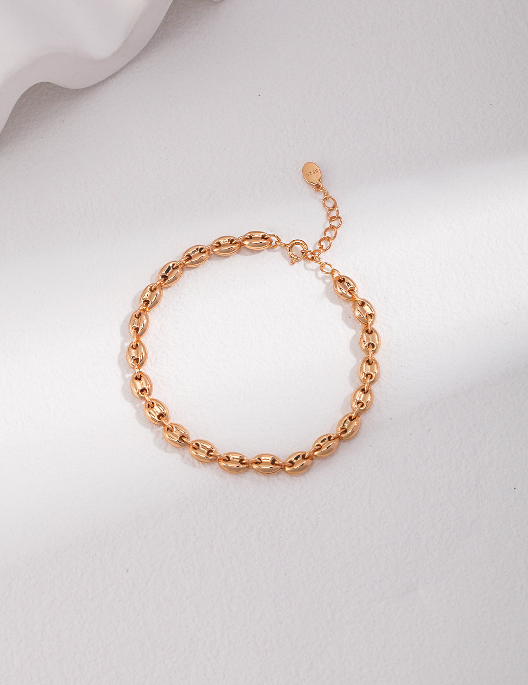 Gold plated bracelet with delicate chain of interlocking links.