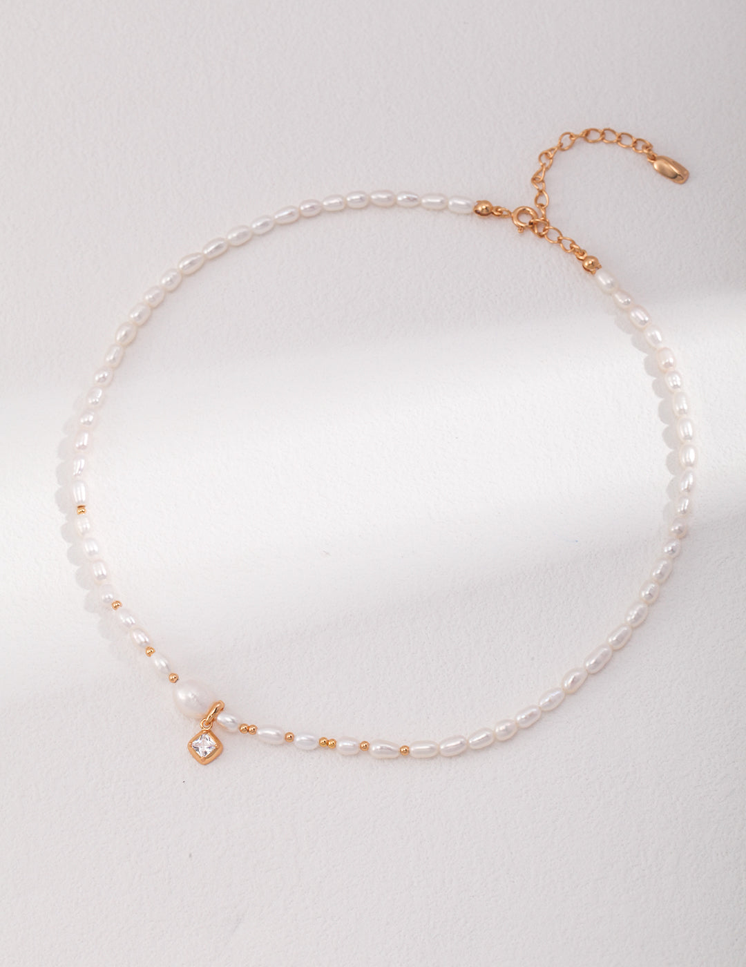 Gold and white freshwater pearl necklace, exuding elegance and sophistication.