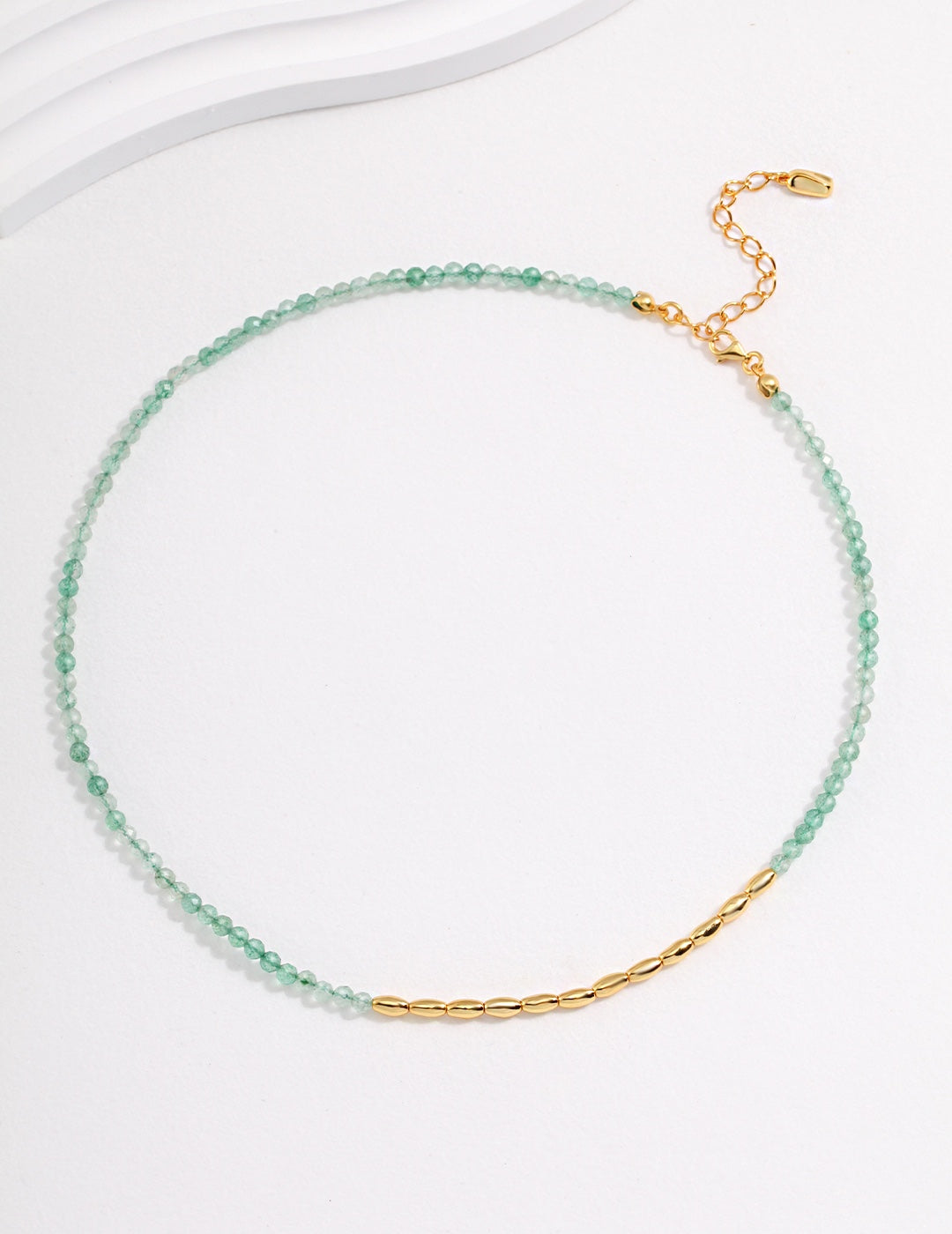 Gold and green choker with bar, adorned with Green Strawberry Quartz.