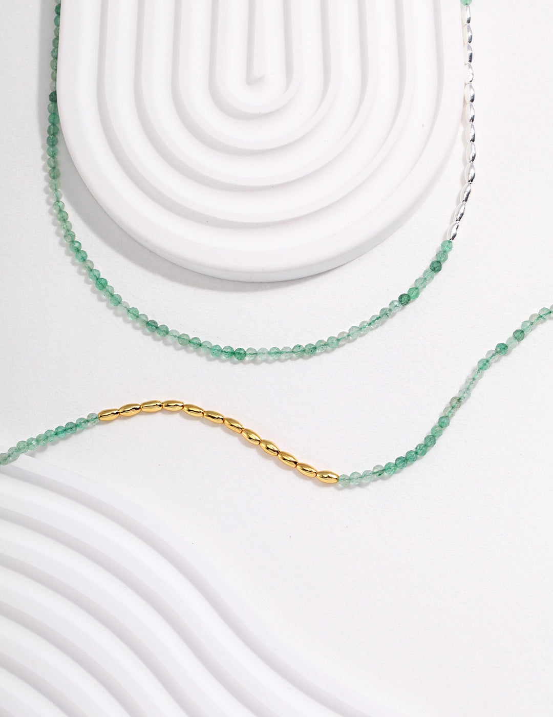 Green Strawberry Quartz necklace featuring elegant dainty beads, available in both silver and gold variations.