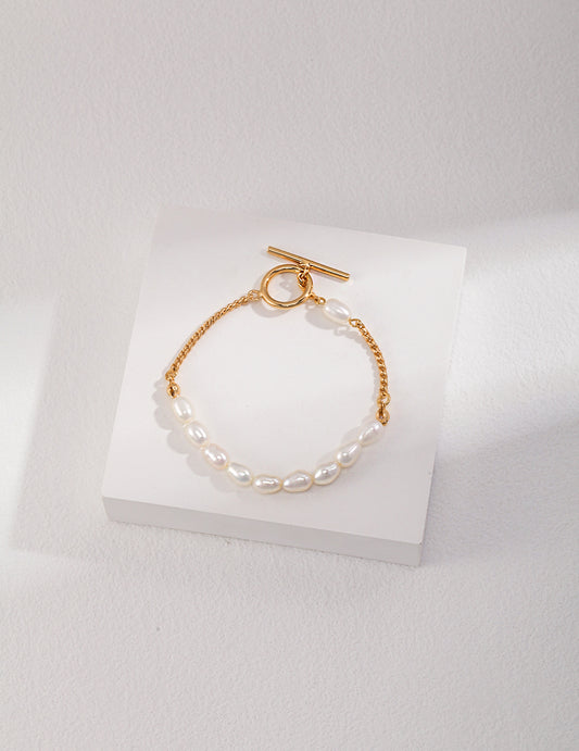 Gold plated chain bracelet with freshwater pearls.