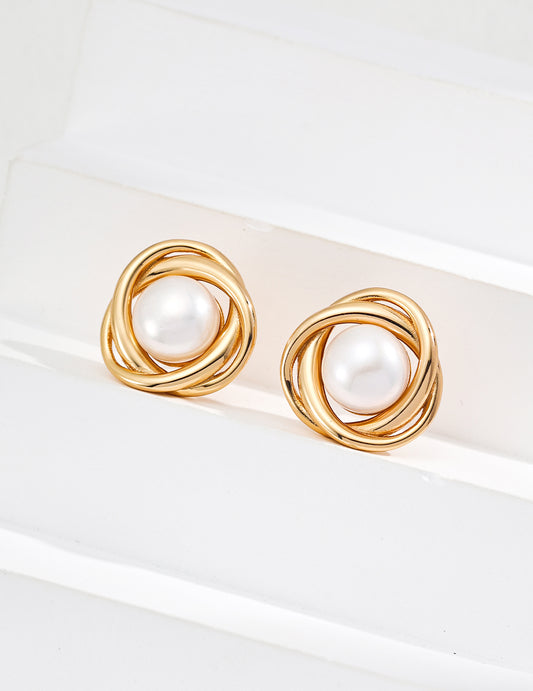 Chic gold tone pearl stud earrings, ideal for elevating everyday wear or special occasions with elegance.