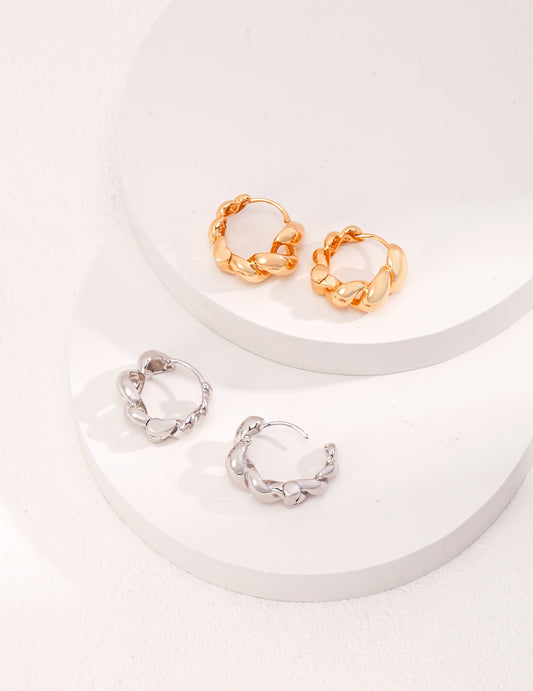 Assortment of chic silver and gold hoops.