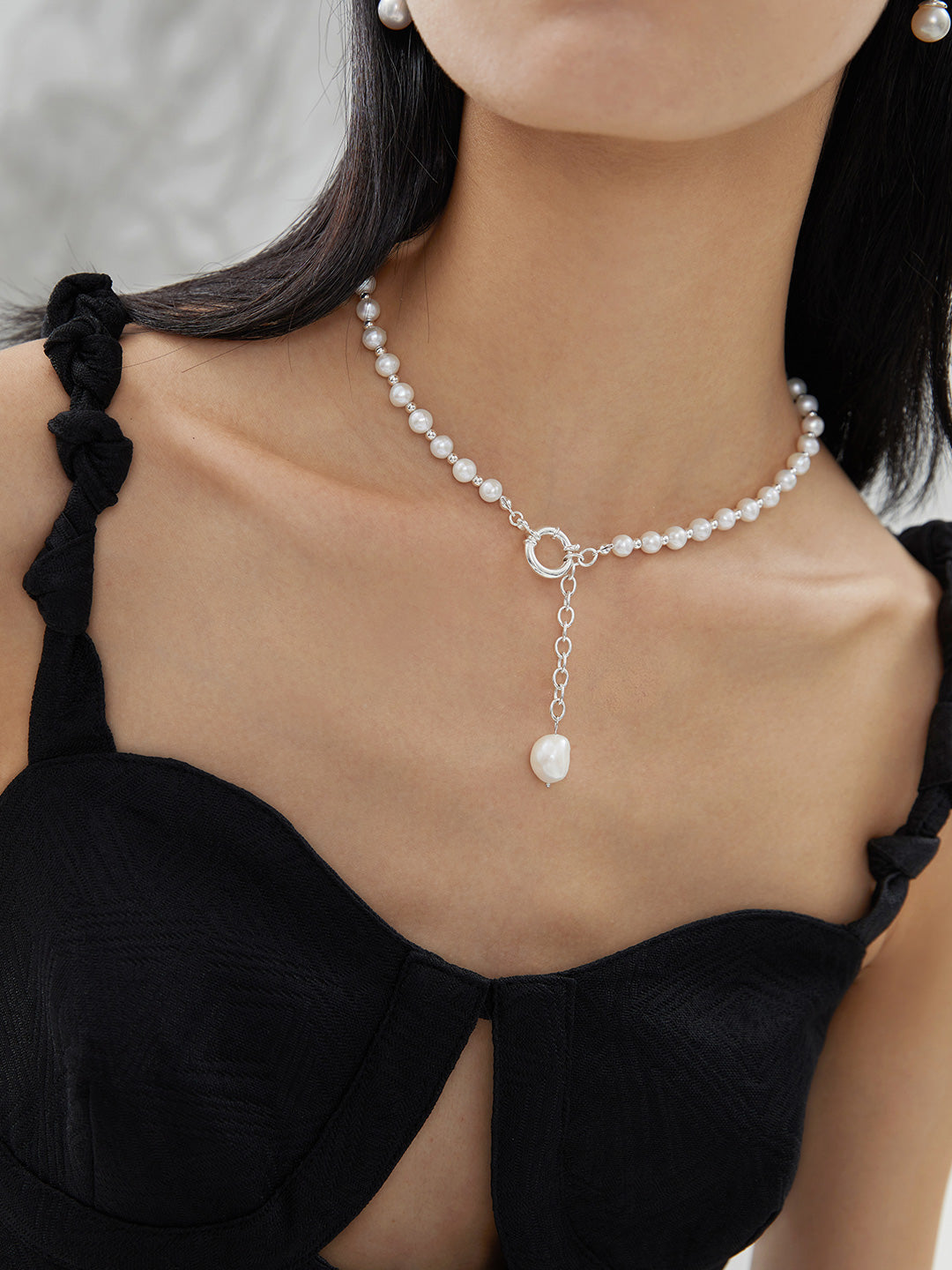 Close-up profile of a model wearing the silver Willow necklace, emphasizing the clean lines and "Quiet Luxury" feel.